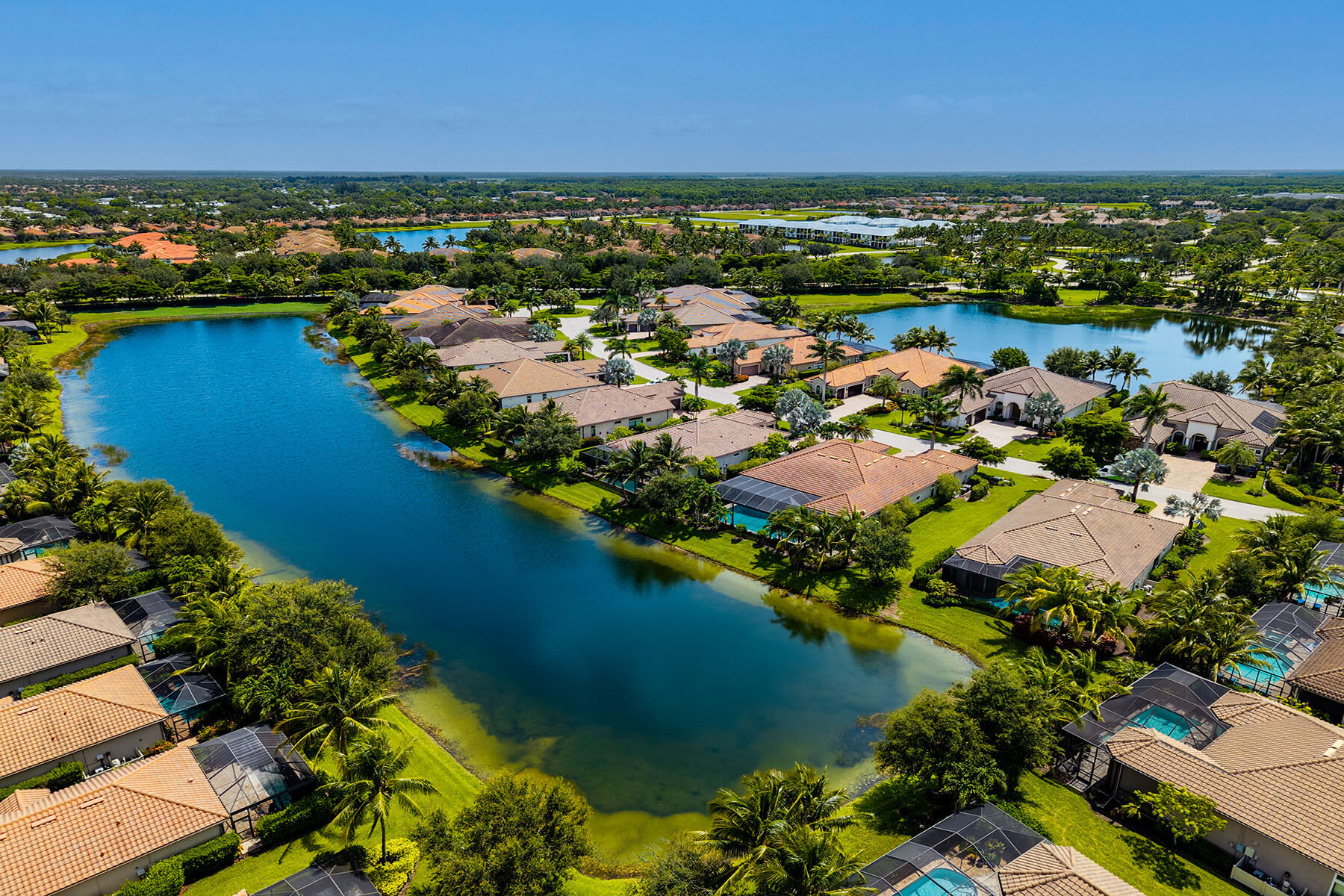 3193 Olympia Lane Naples, FL 34114 - Photo 39 of 50 an aerial view of residential houses with outdoor space and lake view