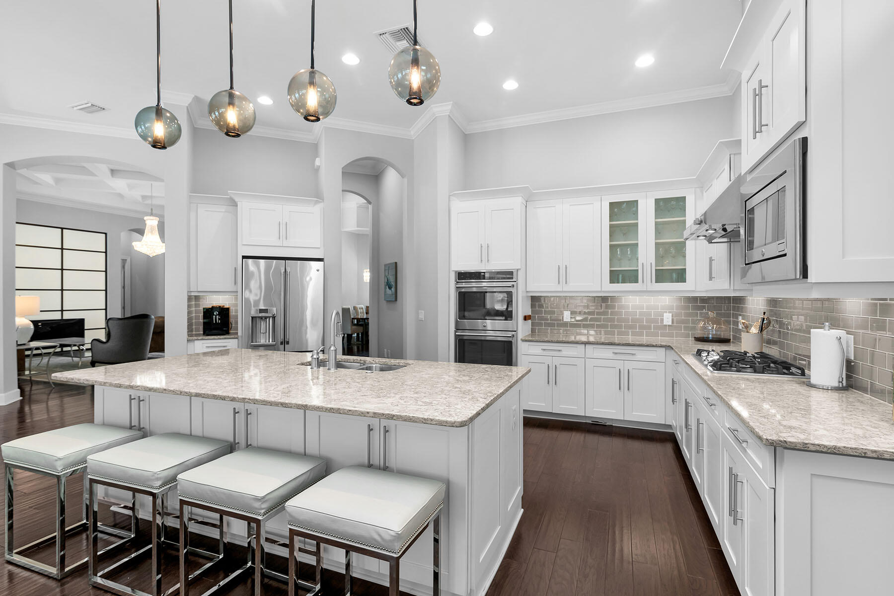 3193 Olympia Lane Naples, FL 34114 - Photo 8 of 50 a large kitchen with a table and chairs