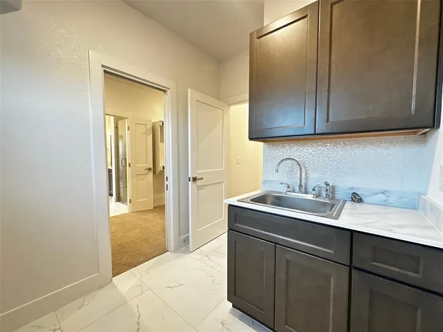 a view of a kitchen from the hallway
