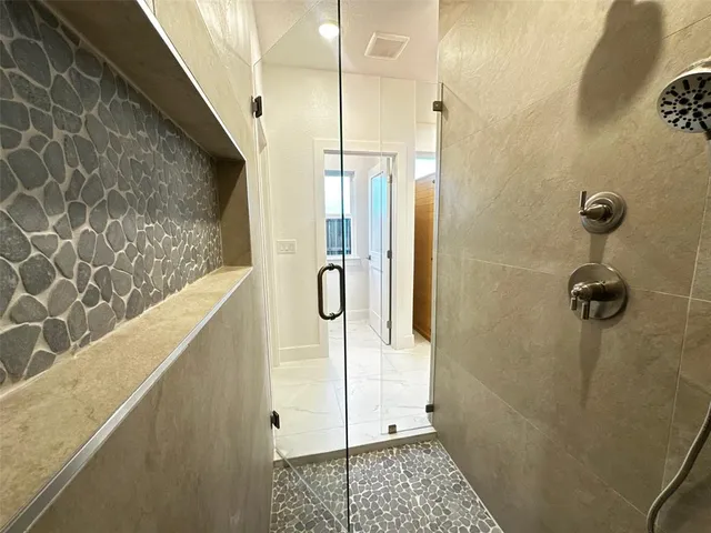 a view of bathroom with a toilet sink and a shower