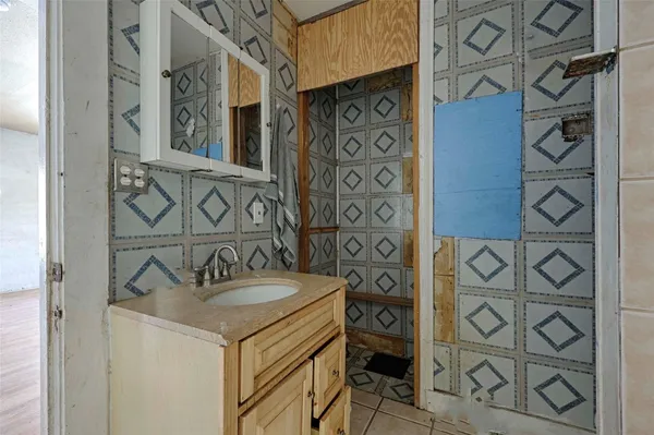 a bathroom with a sink and a mirror