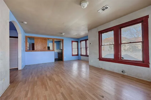 a view of livingroom with hardwood floor and hallway