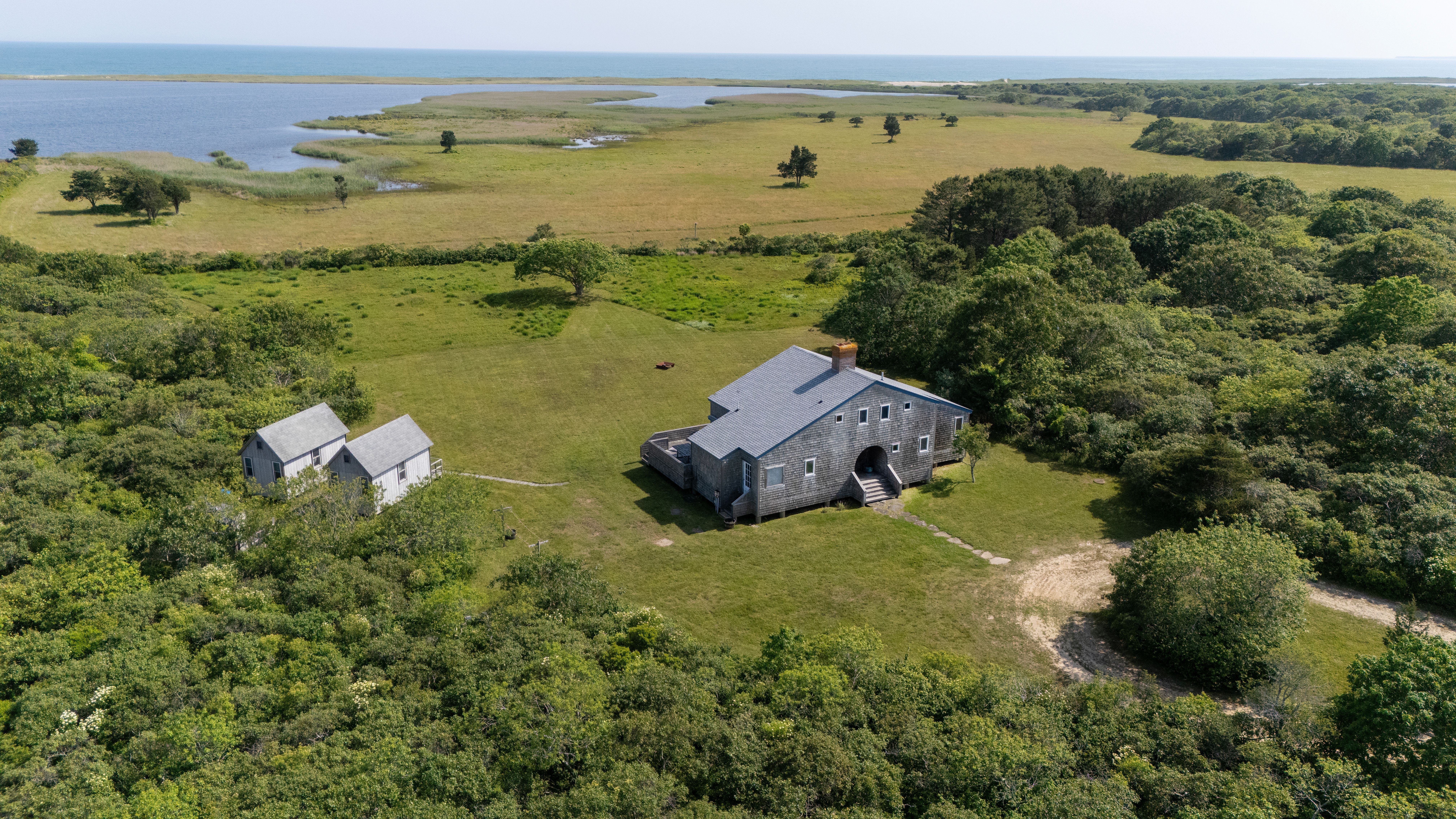 38 Black Point Road Chilmark, MA 02535 - Photo 3 of 38 an aerial view of a house with a lake view