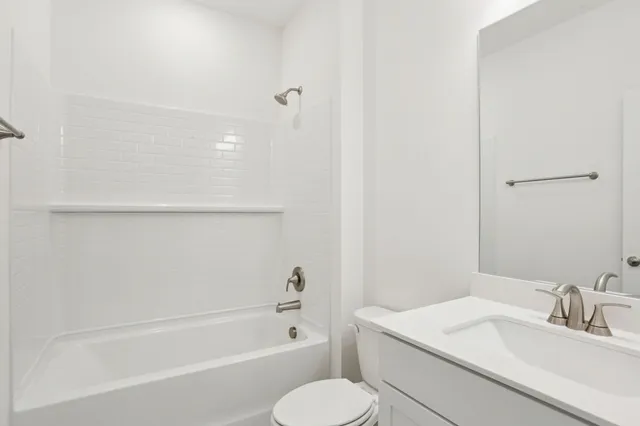 a bathroom with a sink toilet and bathtub