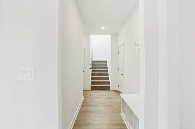 a view of a hallway with stairs and stairs