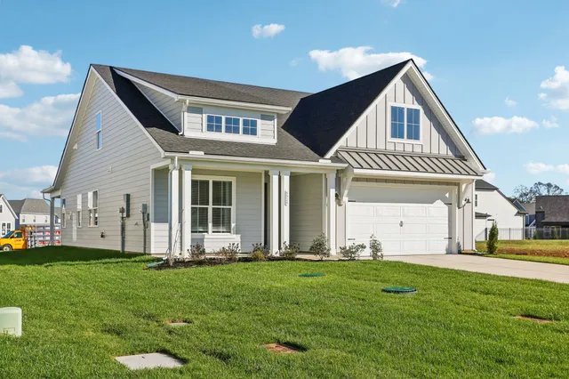 a front view of a house with a yard
