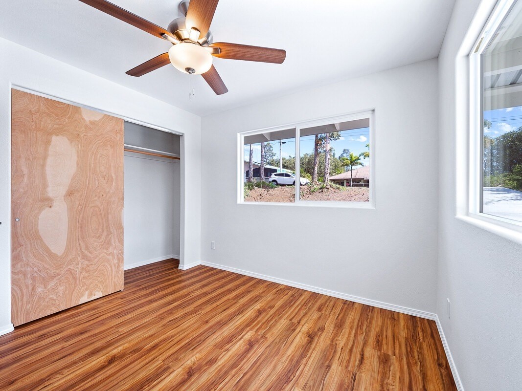 Peleke Road Mountain View, HI 96771 - Photo 11 of 24 a view of empty room with wooden floor and fan