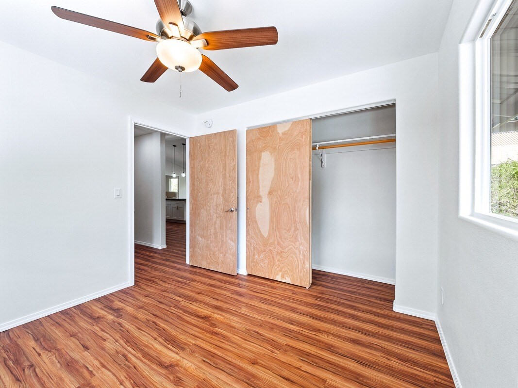 Peleke Road Mountain View, HI 96771 - Photo 12 of 24 wooden floor in an empty room with a window