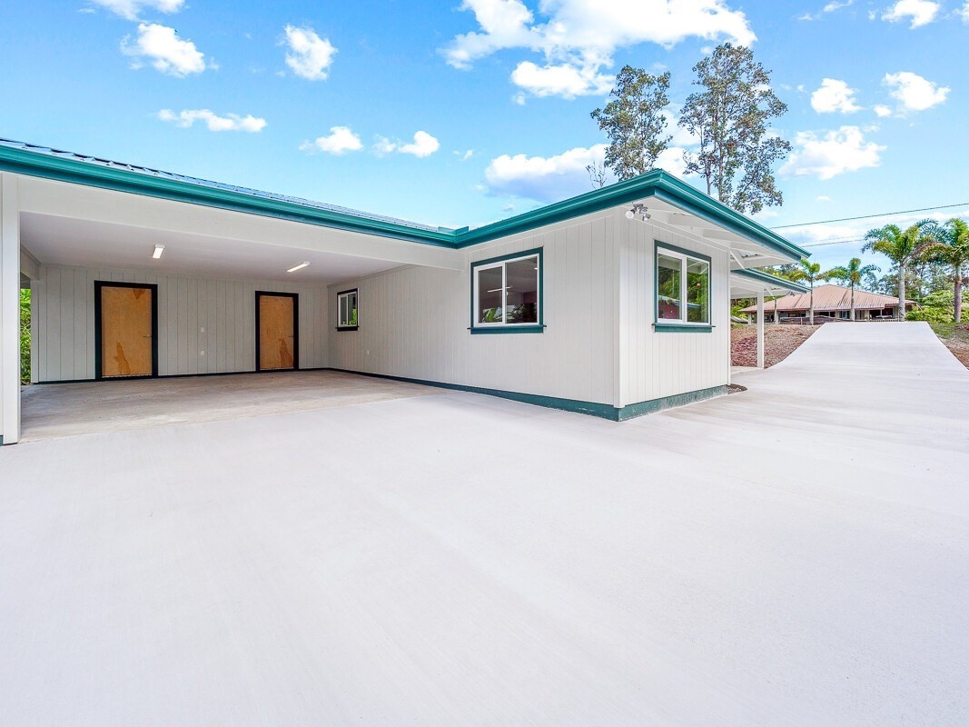Peleke Road Mountain View, HI 96771 - Photo 22 of 24 a view of a house with a garage