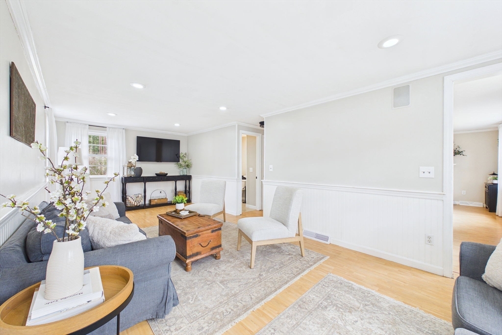 13 Albatross Avenue Wareham, MA 02538 - Photo 15 of 25 a living room with furniture and a dining table with wooden floor