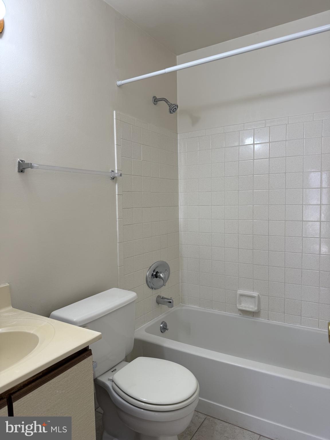 131 Chadd Road, Unit A Newark, DE 19711 - Photo 6 of 8 a bathroom with a toilet a sink and a shower