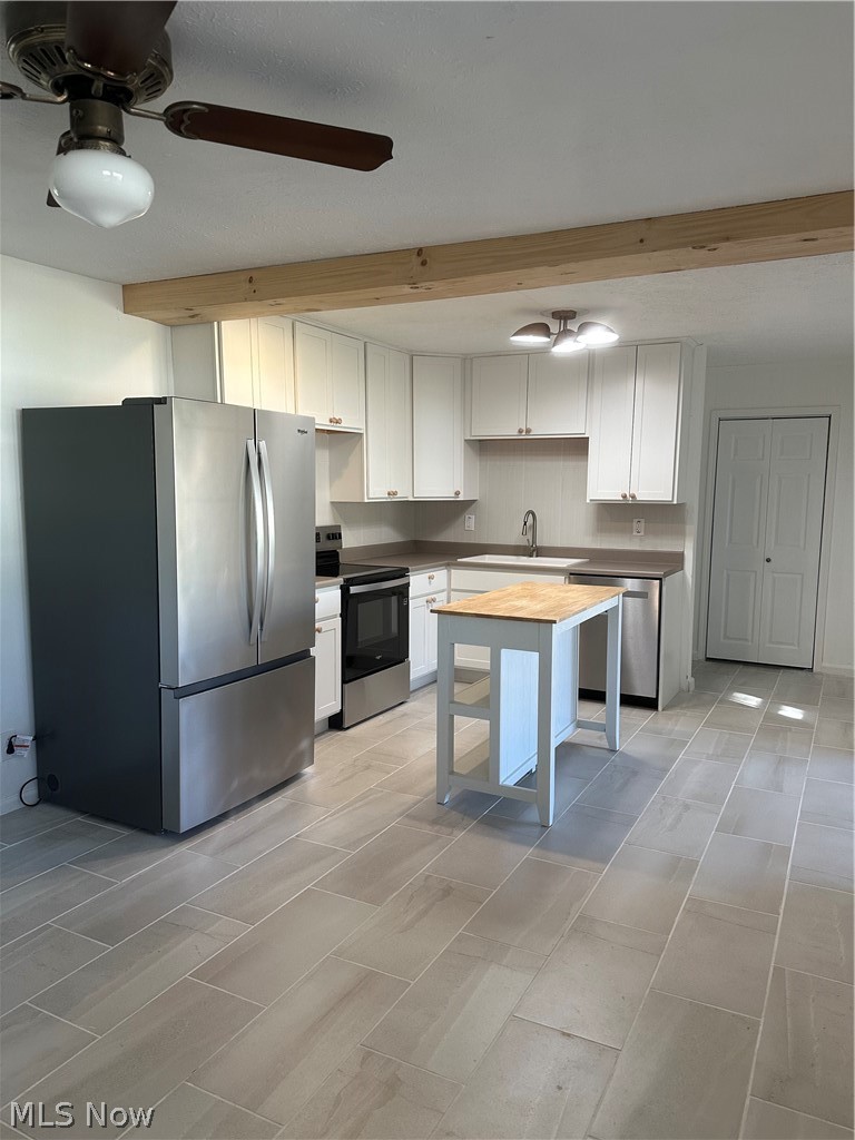 121 Andover Road Woodsfield, OH 43793 - Photo 3 of 46 Newly remodeled kitchen with new fridge, stove, island, and dishwasher