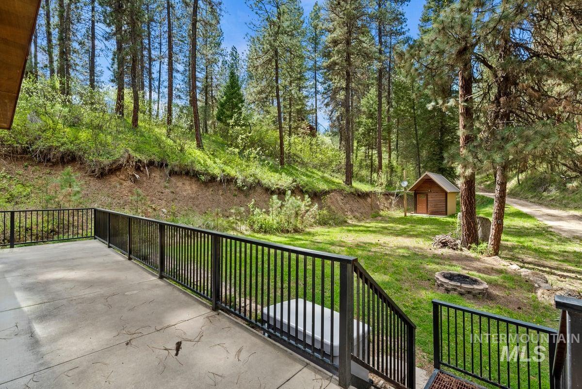 11 Forest Trail Road Garden Valley, ID 83622 - Photo 32 of 42 View of patio / terrace with a fire pit and a shed
