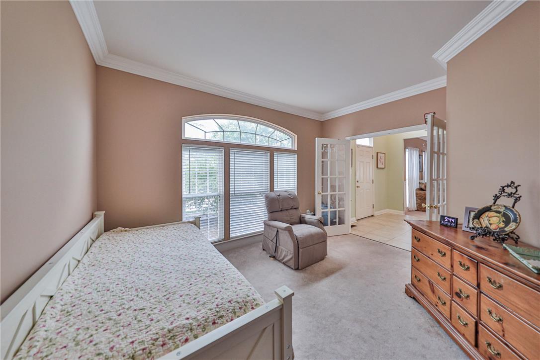 138 Clover Hollow Road Easton, PA 18045 - Photo 16 of 95 Natural light streams into this versatile room, highlighted by elegant crown molding and soft carpeting.