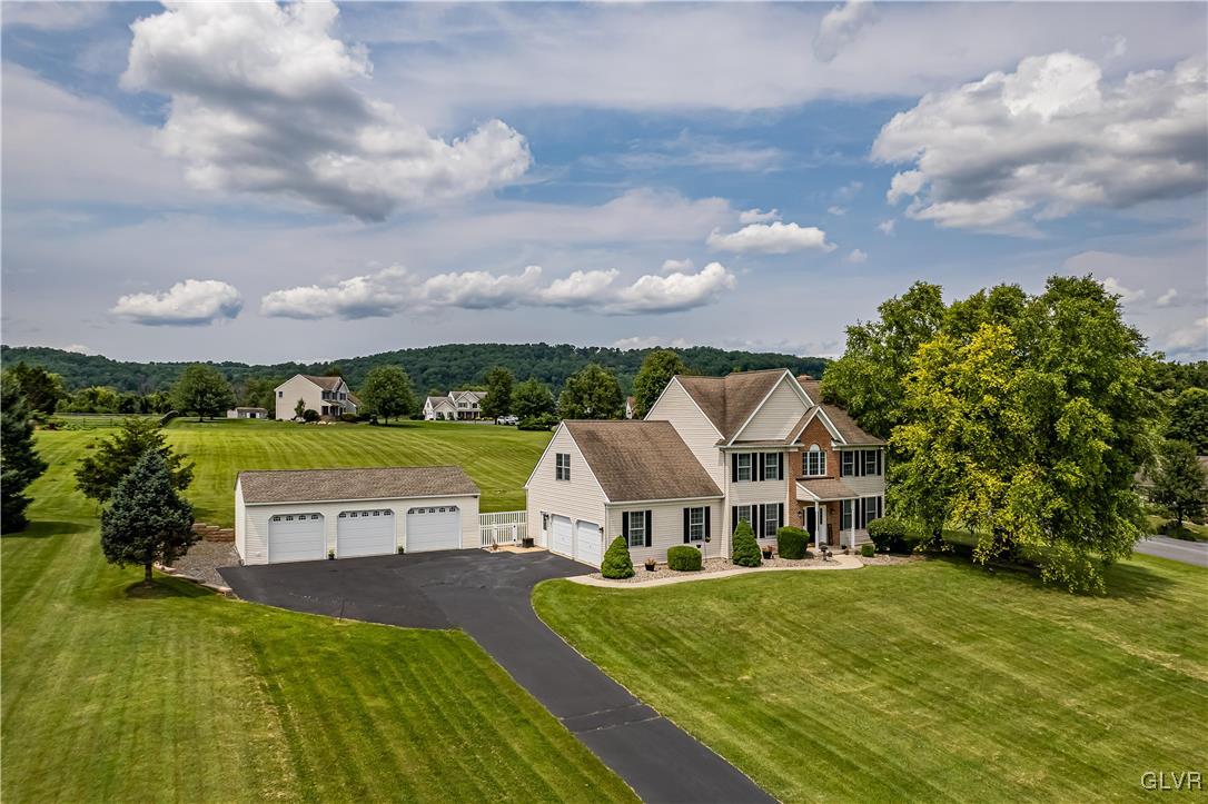 140 Ridge Road Easton, PA 18042 - Photo 3 of 50 an aerial view of a house with swimming pool garden and trees in the background