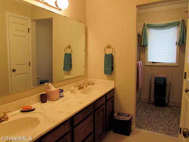 604 Ragsdale Road Jamestown, NC 27282 - Photo 11 of 16 Master Bath/Spa. Double sinks for convenience with separate toilet/shower area.