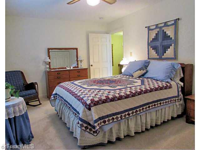 604 Ragsdale Road Jamestown, NC 27282 - Photo 12 of 16 2nd Bedroom. This bedroom is large, with double wall closets and a bright, sunny window.