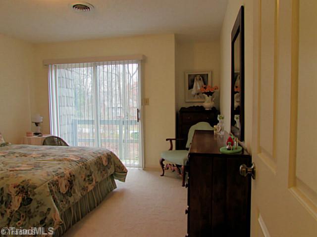 604 Ragsdale Road Jamestown, NC 27282 - Photo 14 of 16 3rd Bedroom. Third bedroom is spacious and has it s own private balcony with large, sliding glass door.