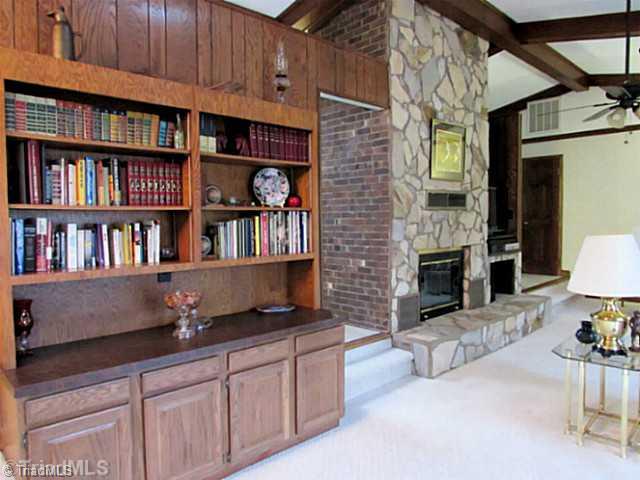 604 Ragsdale Road Jamestown, NC 27282 - Photo 3 of 16 Living Room. Floor-to-ceiling fireplace has gas logs and Heatilator (blower) that will warm the main level & master bedroom. Gorgeous built-ins, too!