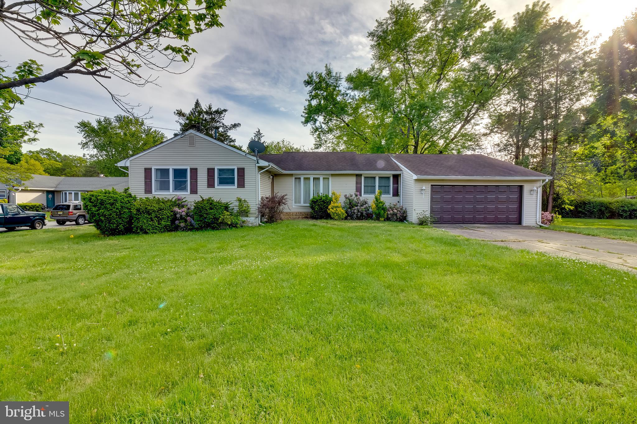 225 Sunnybrook Road Barrington, NJ 08007 - Photo 1 of 26 a view of a house with a yard and large trees