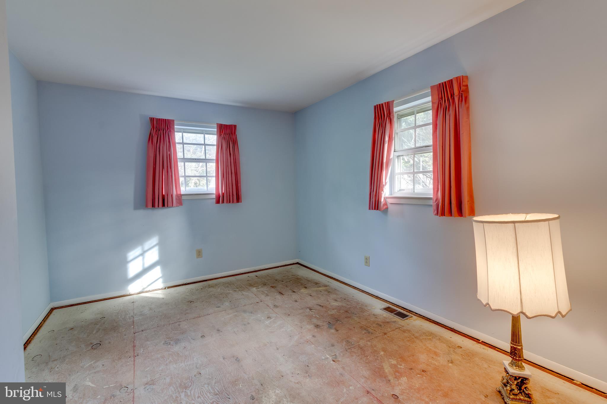 225 Sunnybrook Road Barrington, NJ 08007 - Photo 14 of 26 a view of an empty room with window and wooden floor