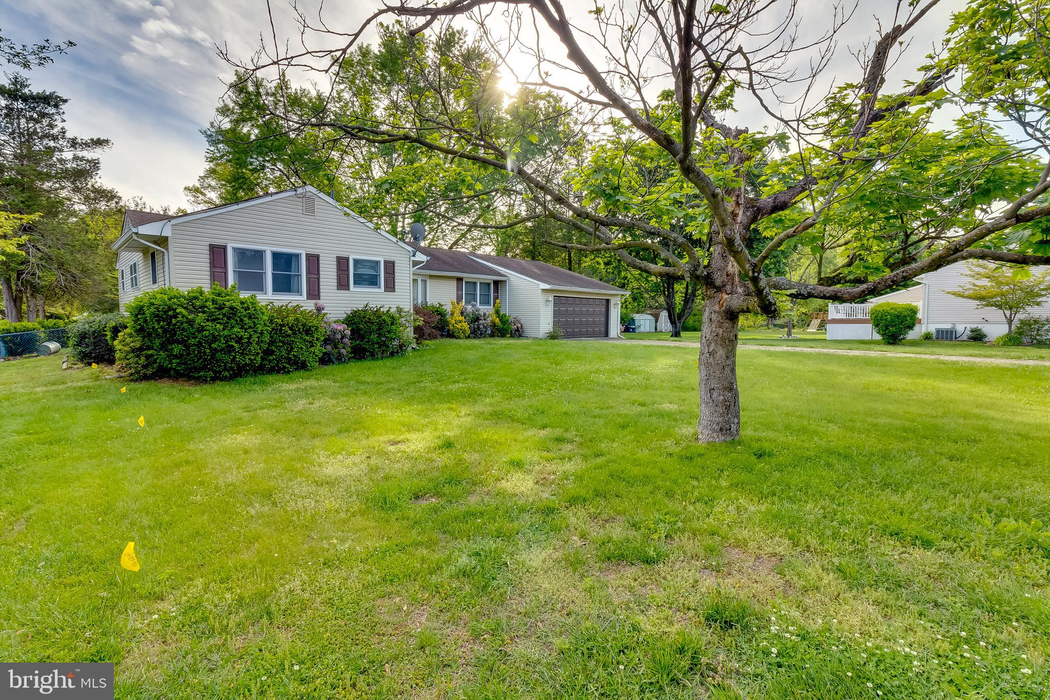 225 Sunnybrook Road Barrington, NJ 08007 - Photo 3 of 26 a front view of a house with garden