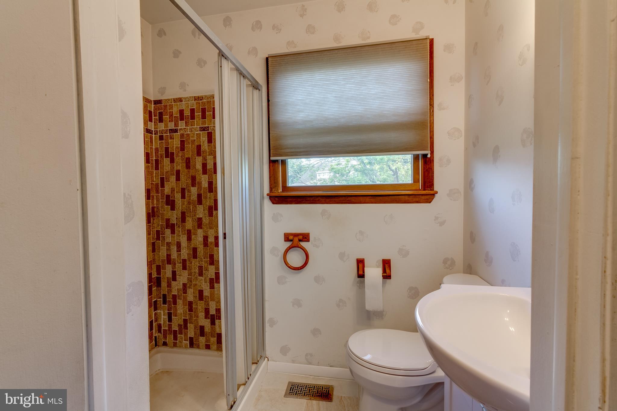 225 Sunnybrook Road Barrington, NJ 08007 - Photo 10 of 26 a white toilet sitting next to a bathroom sink
