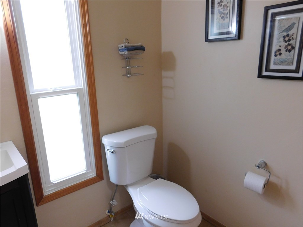 2902 Jackson Highway Chehalis, WA 98532 - Photo 22 of 32 a white toilet sitting next to a bathroom sink