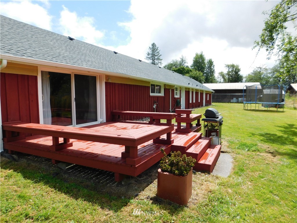 2902 Jackson Highway Chehalis, WA 98532 - Photo 26 of 32 a view of a house with pool and chairs