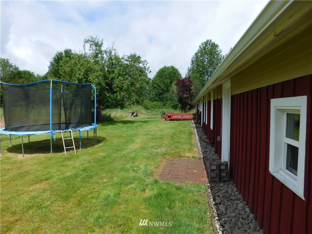 2902 Jackson Highway Chehalis, WA 98532 - Photo 27 of 32 a view of a chair and table in backyard of the house