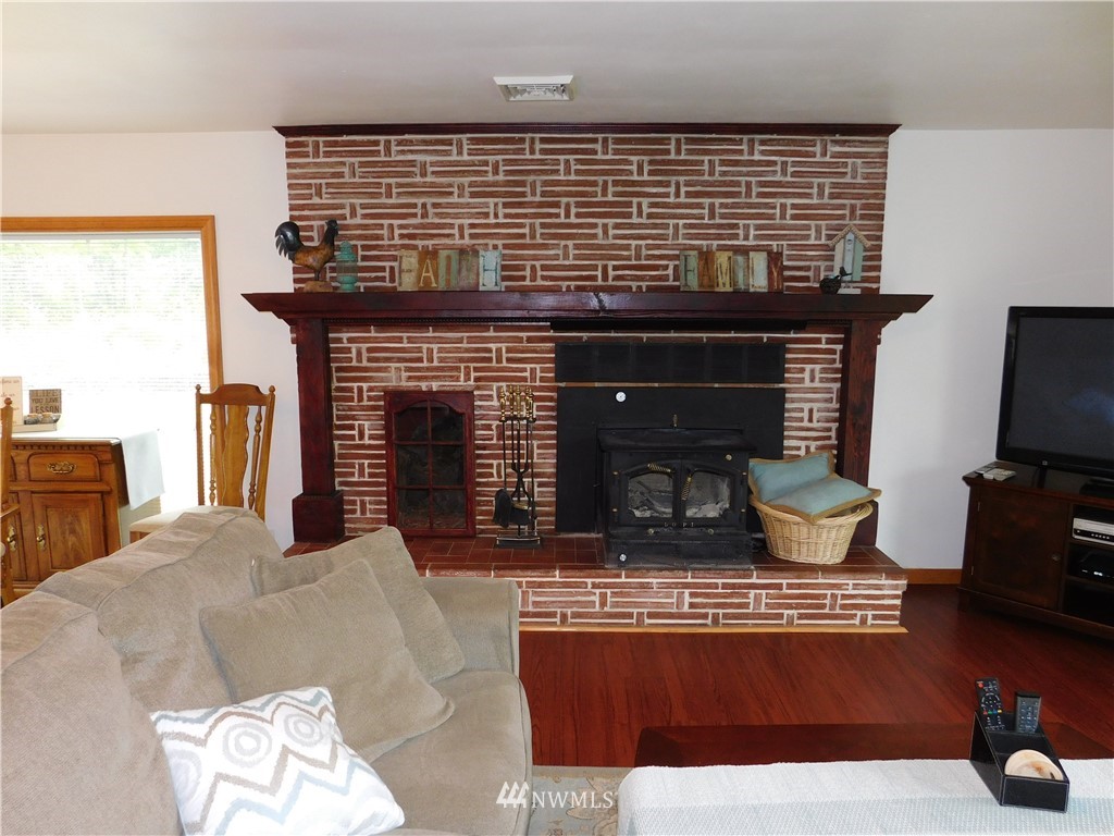 2902 Jackson Highway Chehalis, WA 98532 - Photo 7 of 32 a living room with fireplace furniture and a flat screen tv