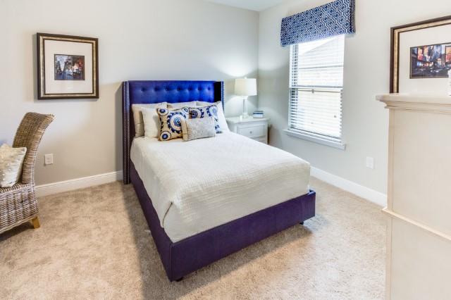 127 Hobson Avenue Crestview, FL 32539 - Photo 12 of 21 a bed sitting in a bedroom next to a window