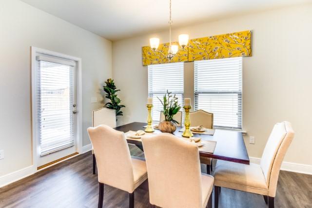 127 Hobson Avenue Crestview, FL 32539 - Photo 6 of 21 a view of a dining room with furniture and wooden floor