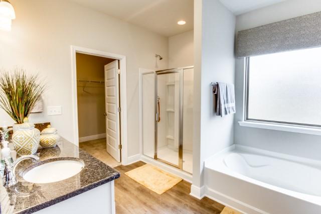 127 Hobson Avenue Crestview, FL 32539 - Photo 8 of 21 a spacious bathroom with a granite countertop sink and a mirror