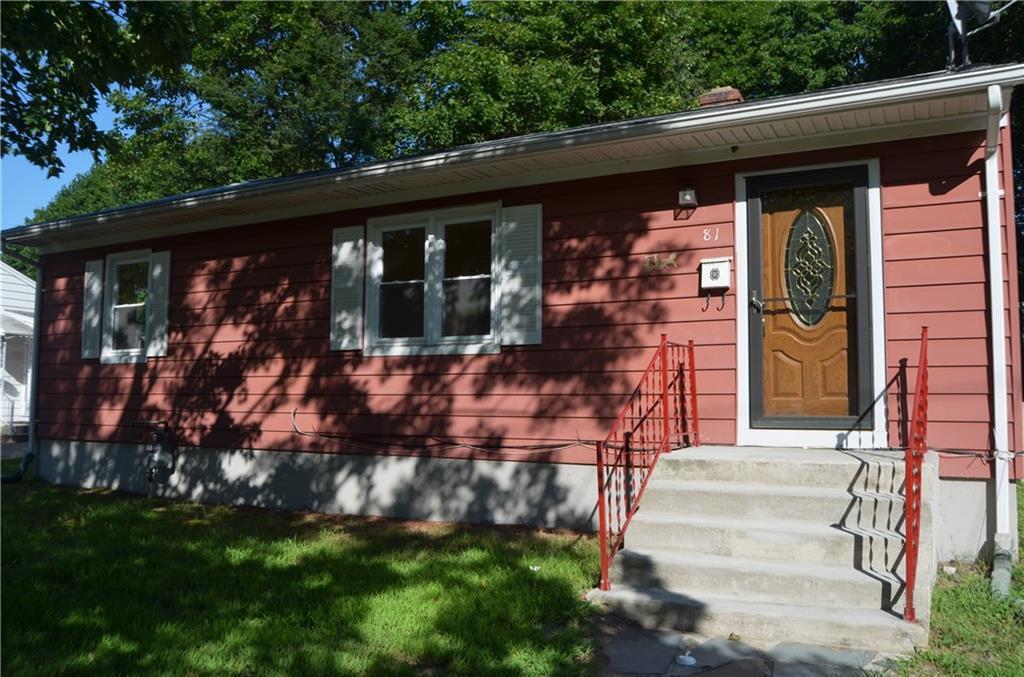 a front view of house with a yard