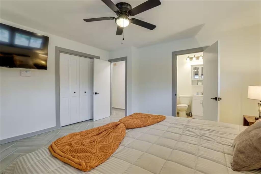 1944 Cindy Drive Decatur, GA 30032 - Photo 13 of 22 a bedroom with a bed and a flat screen tv