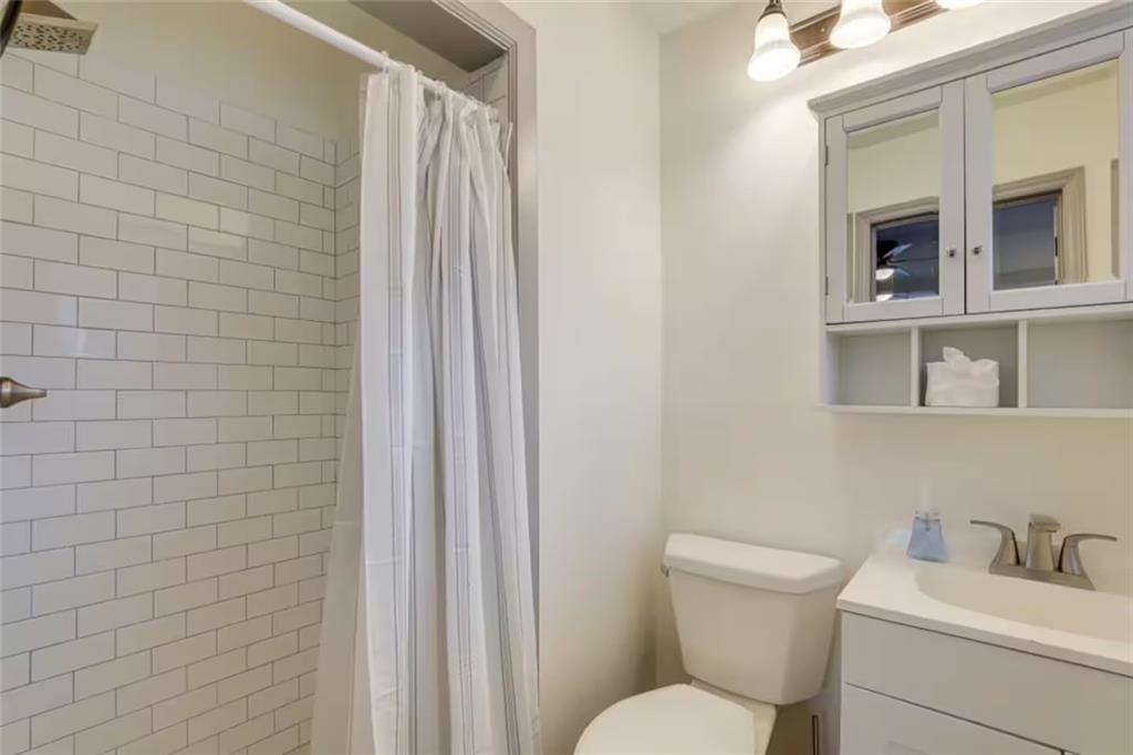 1944 Cindy Drive Decatur, GA 30032 - Photo 14 of 22 a white toilet sitting next to a bathroom sink