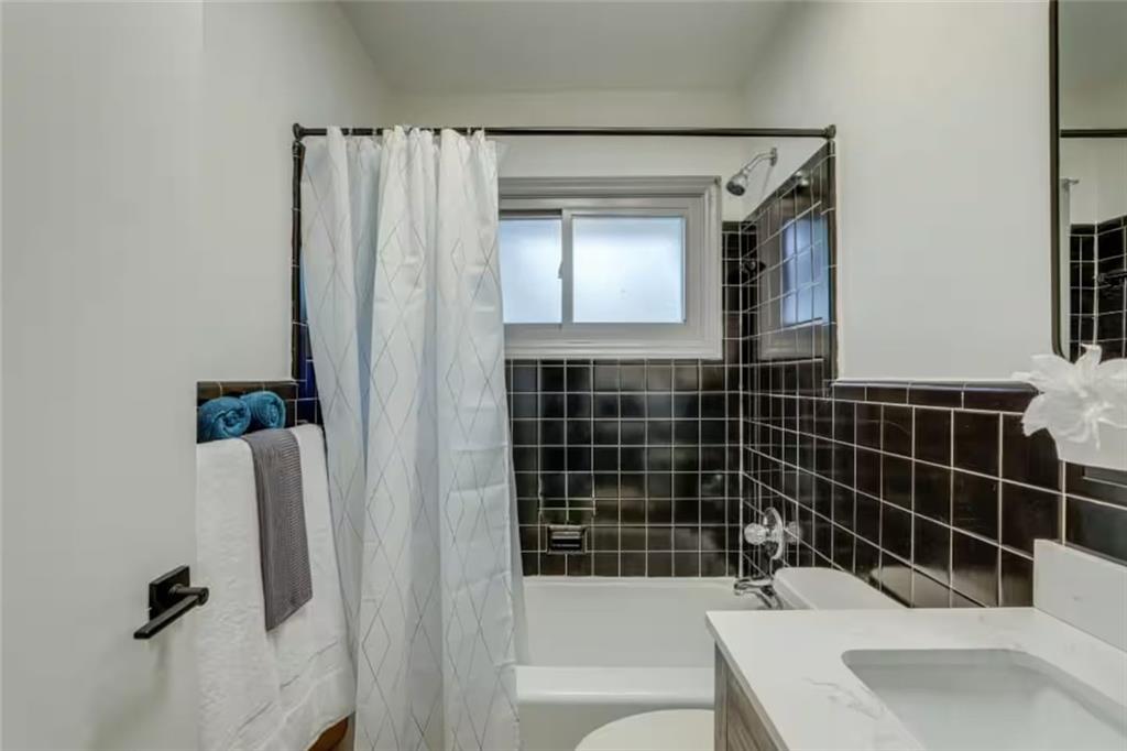 1944 Cindy Drive Decatur, GA 30032 - Photo 17 of 22 a bathroom with a sink toilet and shower