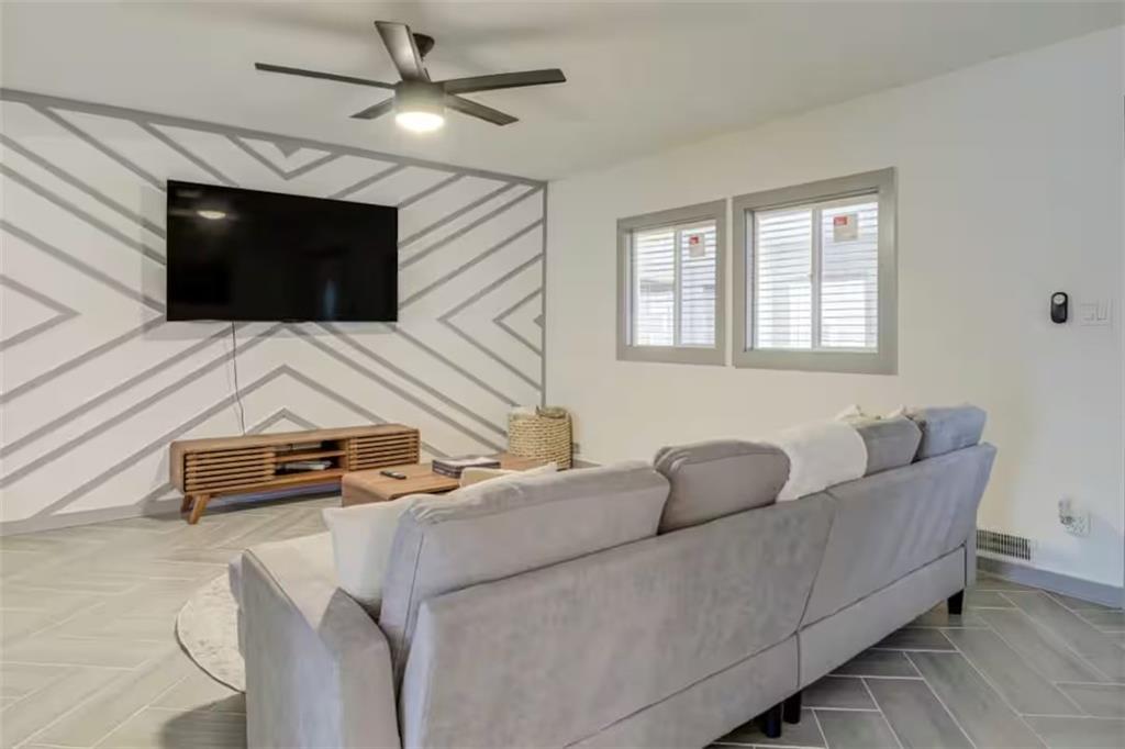 1944 Cindy Drive Decatur, GA 30032 - Photo 6 of 22 a living room with furniture and a flat screen tv