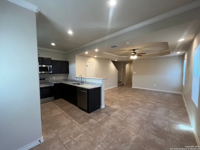 a large bathroom with a large tub and sink