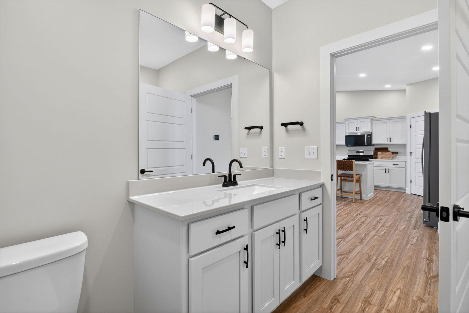 412 North 2nd Street Eldridge, IA 52748 - Photo 27 of 30 a spacious bathroom with a double vanity sink and a mirror