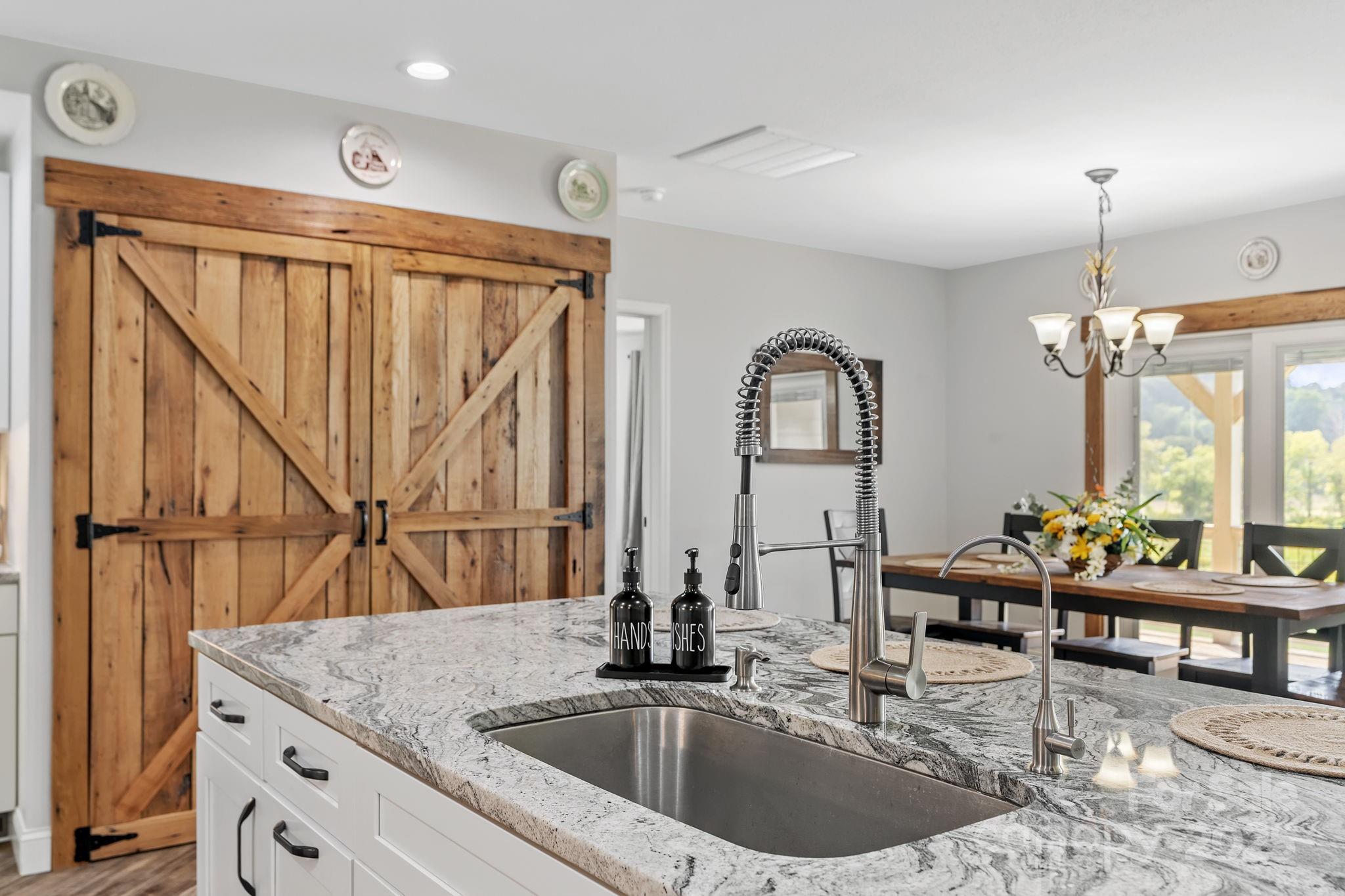 204 Mountain Spring Lane Canton, NC 28716 - Photo 17 of 45 a kitchen with stainless steel appliances kitchen island granite countertop a sink and cabinets