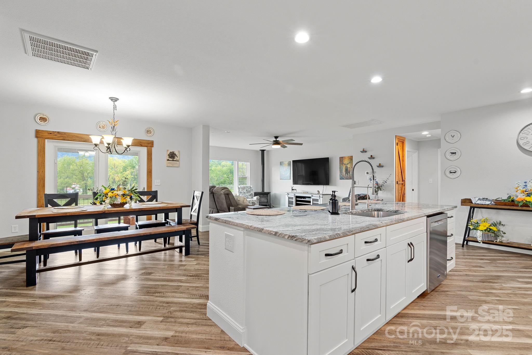 204 Mountain Spring Lane Canton, NC 28716 - Photo 18 of 45 a large white kitchen with a large window