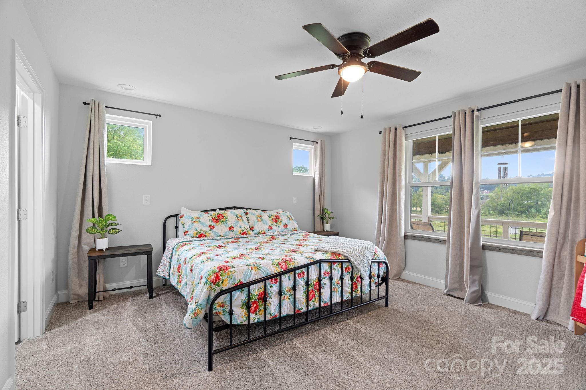 204 Mountain Spring Lane Canton, NC 28716 - Photo 22 of 45 a bedroom with a bed and a large window