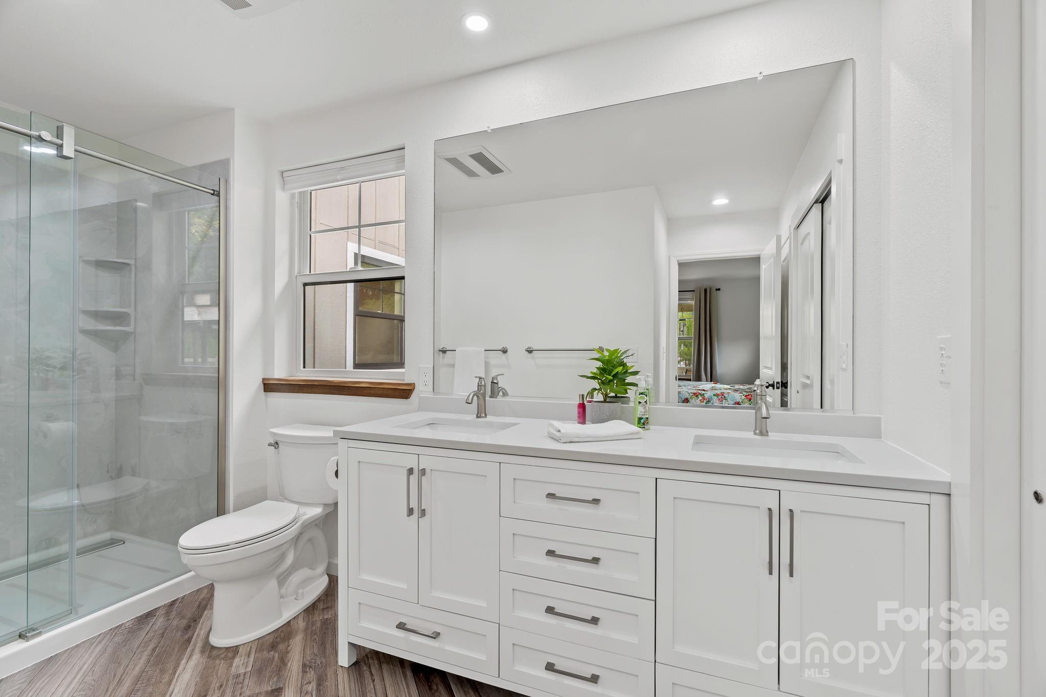 204 Mountain Spring Lane Canton, NC 28716 - Photo 25 of 45 a bathroom with a sink a toilet and shower