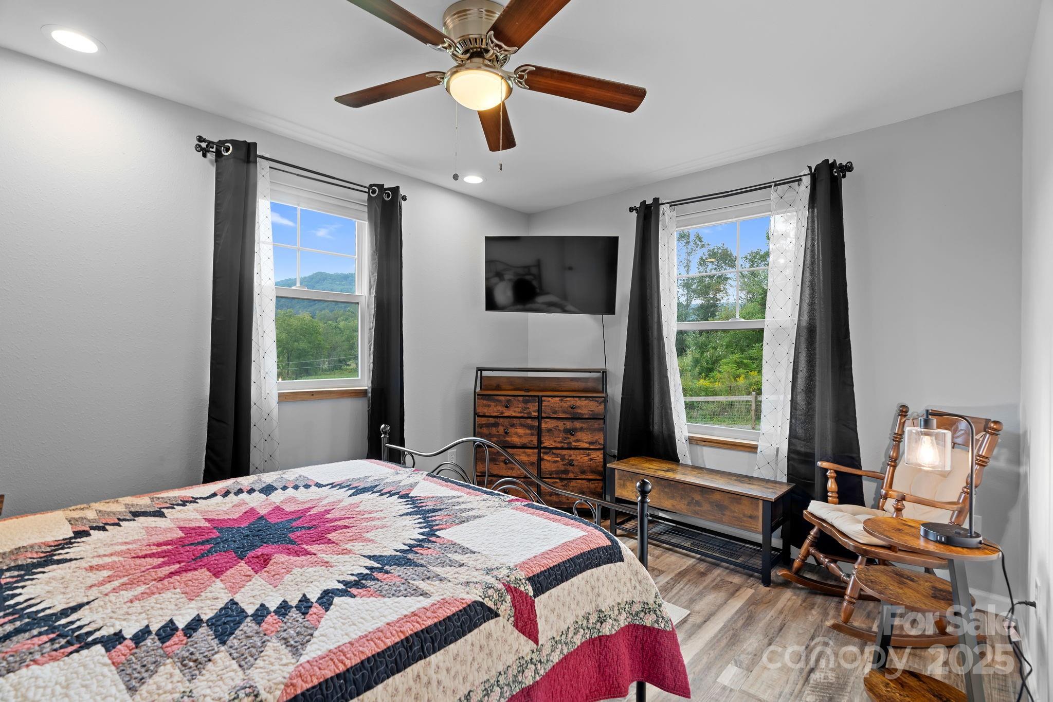 204 Mountain Spring Lane Canton, NC 28716 - Photo 27 of 45 a bedroom with a bed and a large window