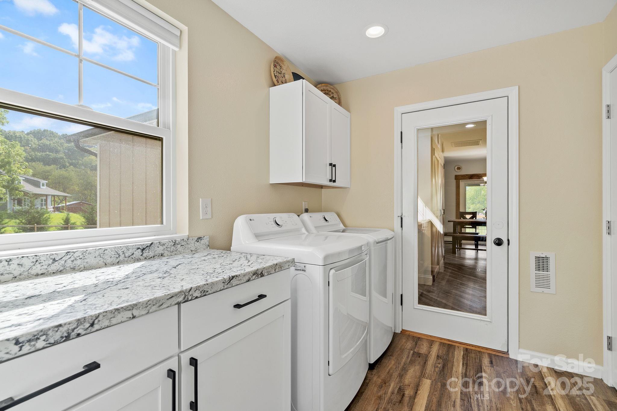 204 Mountain Spring Lane Canton, NC 28716 - Photo 32 of 45 a bathroom with a sink and mirror