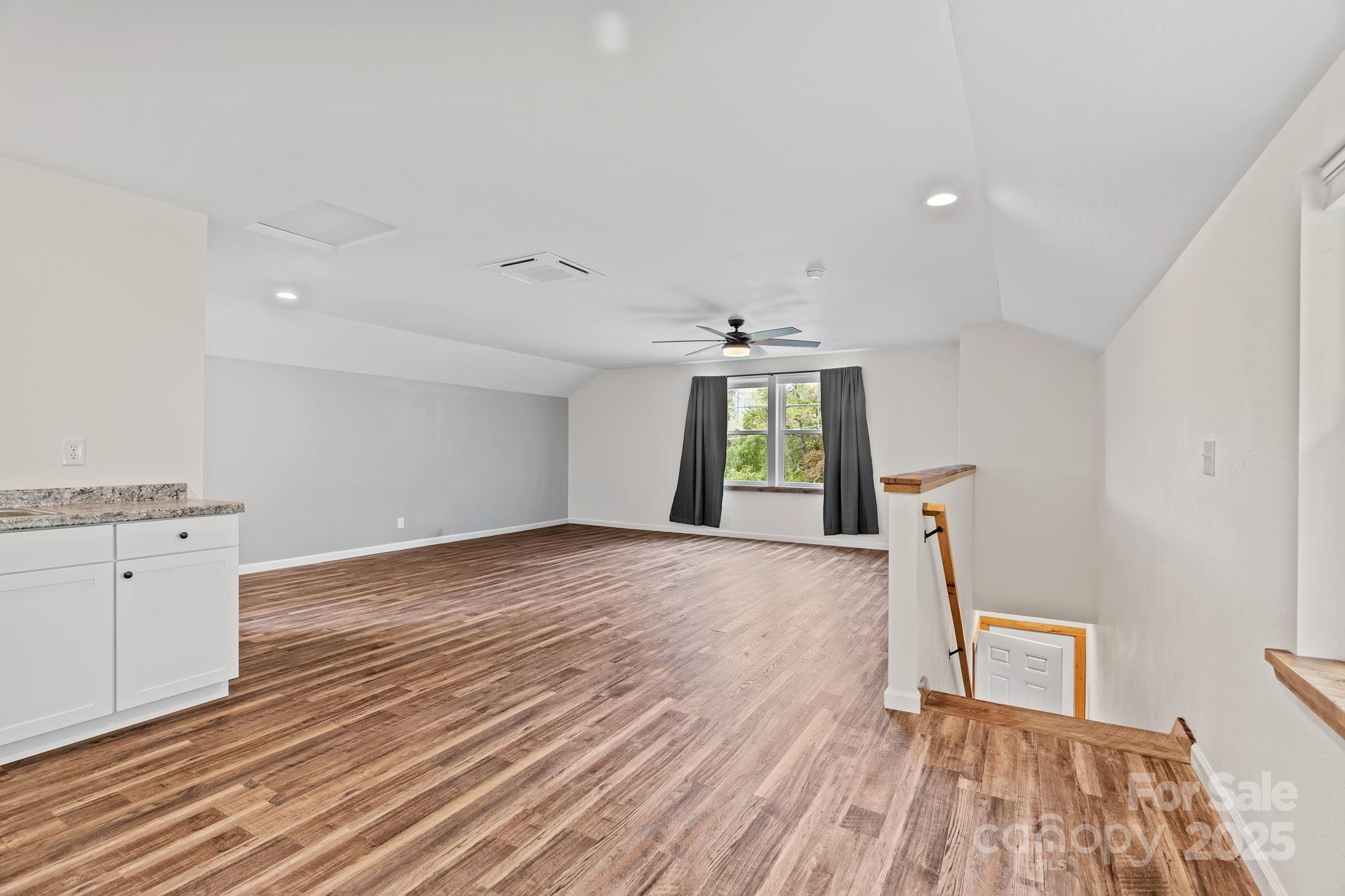 204 Mountain Spring Lane Canton, NC 28716 - Photo 34 of 45 a view of empty room with wooden floor and fan