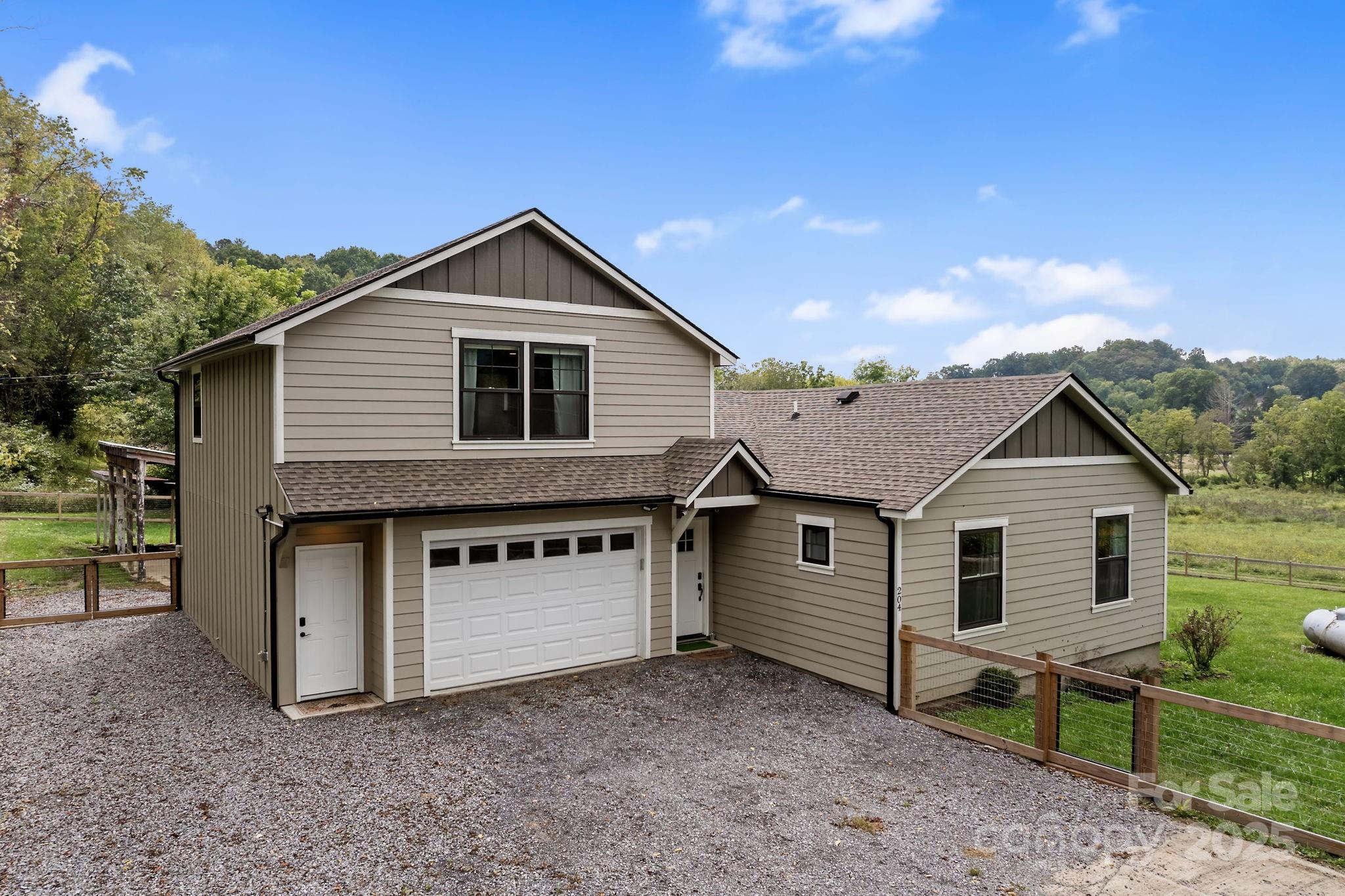 204 Mountain Spring Lane Canton, NC 28716 - Photo 39 of 45 a view of a house with a yard and roof