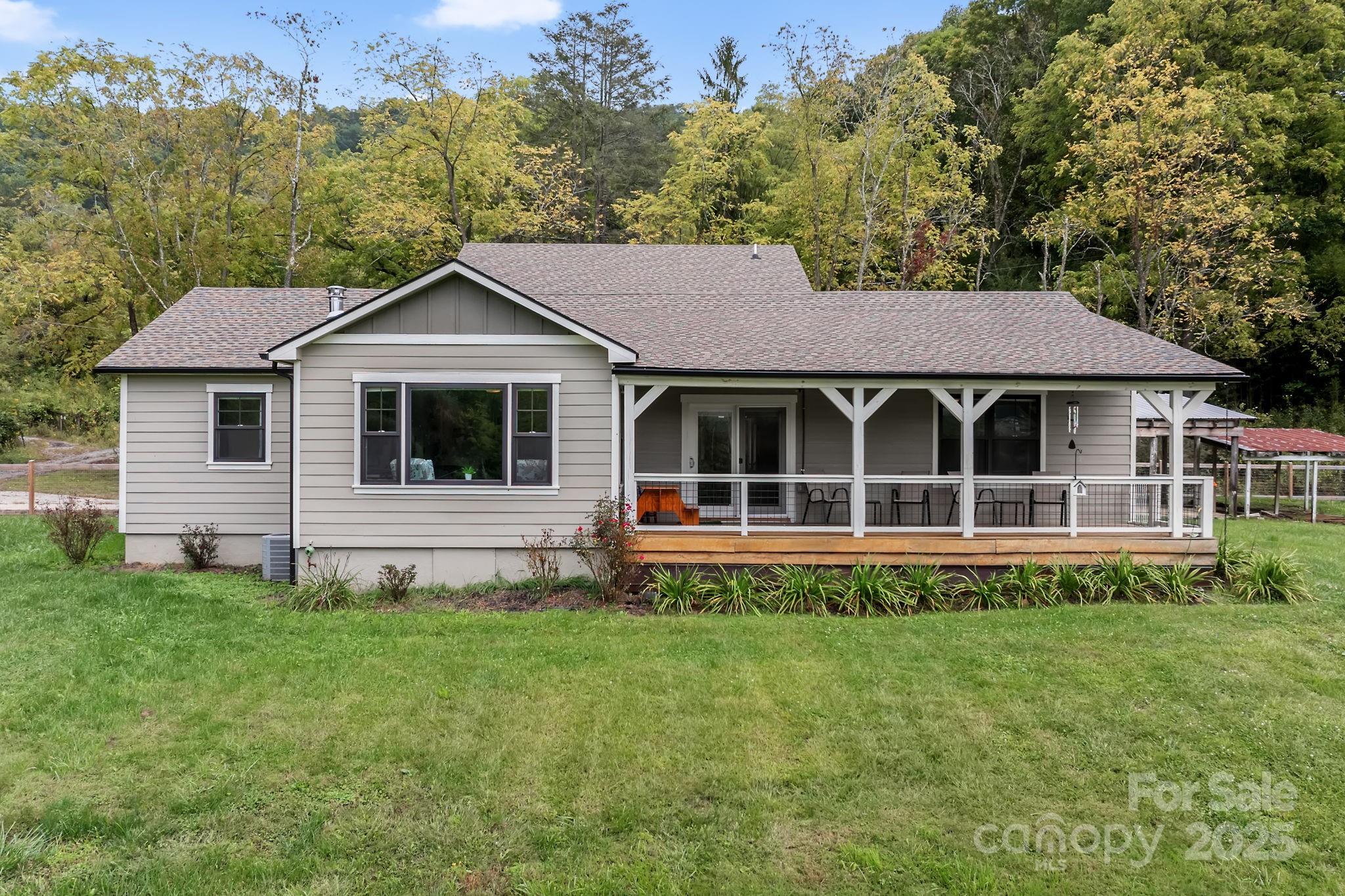 204 Mountain Spring Lane Canton, NC 28716 - Photo 45 of 45 a house view with a garden space